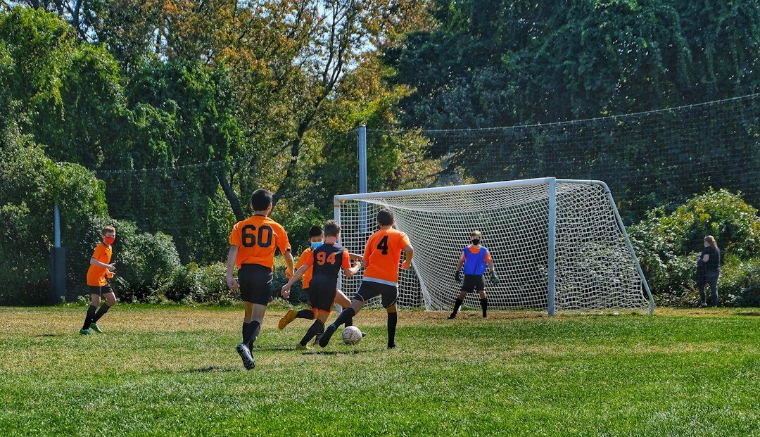 teenagers playing soccer